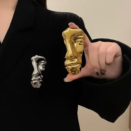HALF FACE BROOCH 